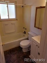 full bathroom featuring vanity,  shower combination, and toilet