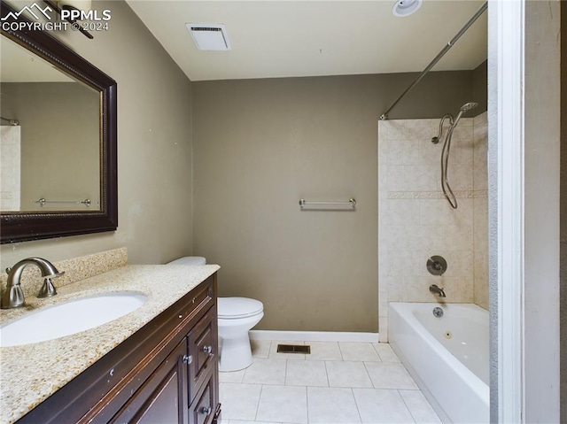 full bathroom with toilet, vanity, tile patterned floors, and tiled shower / bath combo