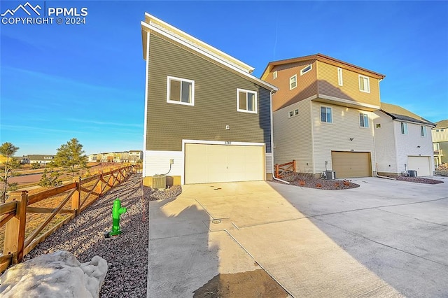 view of side of home with a garage