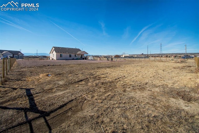 view of yard with a rural view