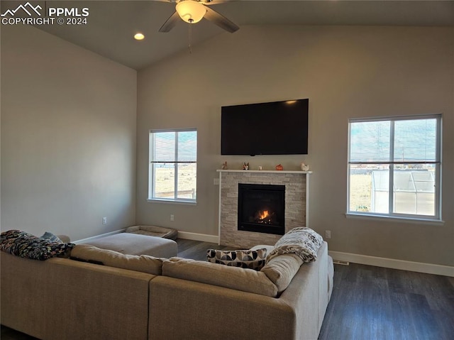 living room featuring dark hardwood / wood-style flooring, ceiling fan, and lofted ceiling