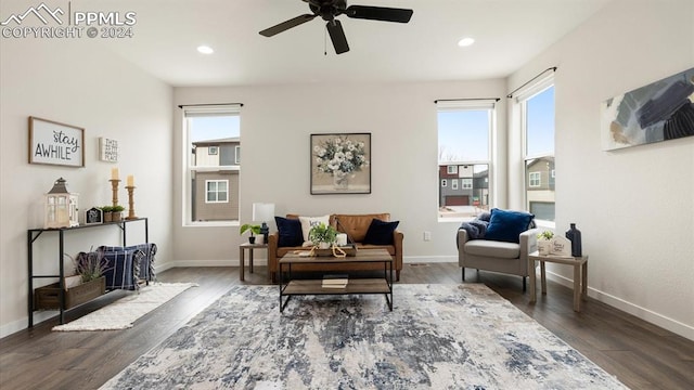 living area featuring hardwood / wood-style flooring, ceiling fan, and a wealth of natural light