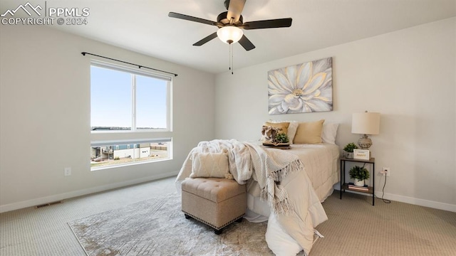 carpeted bedroom with ceiling fan