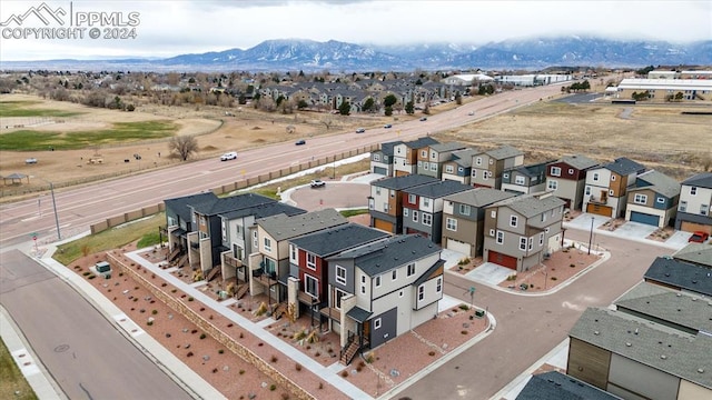 birds eye view of property featuring a mountain view