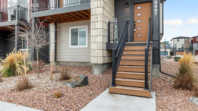 entrance to property featuring a balcony