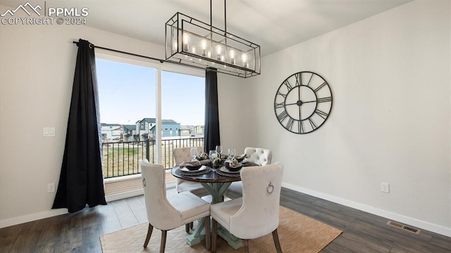 dining area featuring a healthy amount of sunlight and dark hardwood / wood-style floors