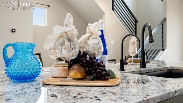 room details with light stone counters and sink