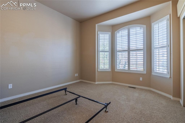 empty room featuring carpet flooring