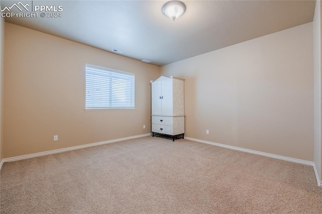 unfurnished bedroom with carpet flooring