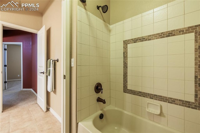 bathroom featuring tile patterned flooring and tiled shower / bath combo