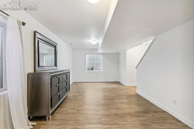 additional living space with light wood-type flooring