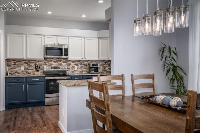 kitchen featuring white cabinetry, dark wood-type flooring, hanging light fixtures, stainless steel appliances, and blue cabinets