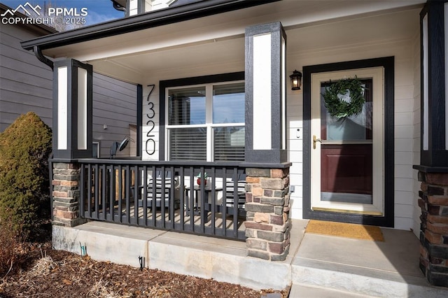 entrance to property featuring a porch