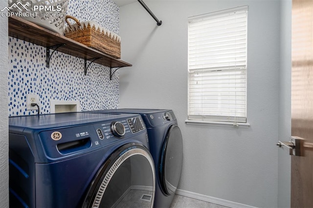 washroom featuring washer and dryer and light tile patterned floors