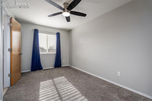 spare room featuring ceiling fan and carpet floors