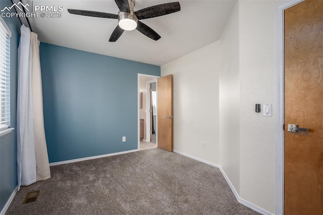 unfurnished bedroom featuring carpet floors and ceiling fan