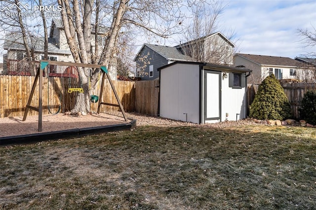 exterior space featuring a lawn and a shed