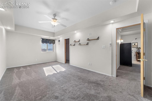 carpeted empty room with ceiling fan