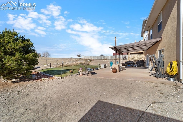 view of yard featuring a pergola and a patio