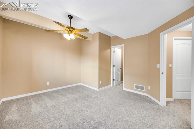 carpeted empty room with ceiling fan