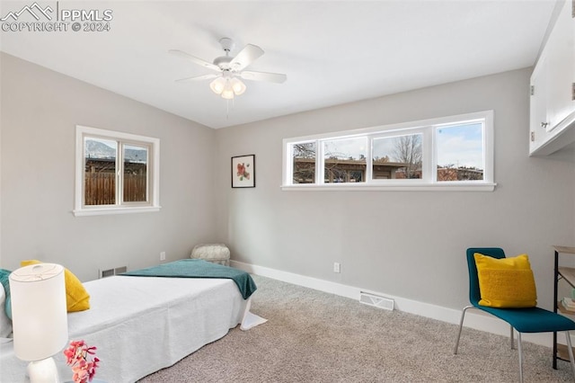 carpeted bedroom featuring ceiling fan