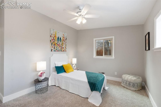 bedroom featuring ceiling fan and carpet