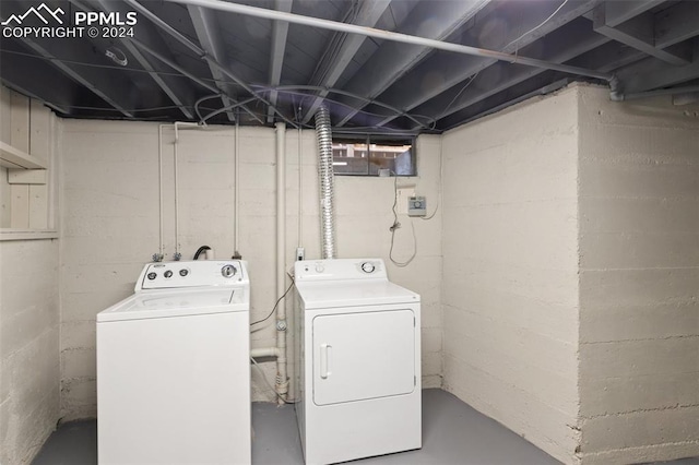 washroom with washing machine and clothes dryer