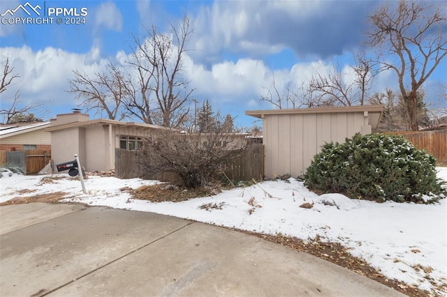 view of snow covered property