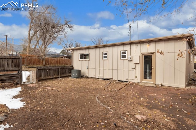 back of property with central air condition unit