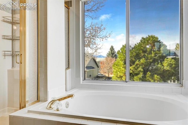 bathroom with tiled tub