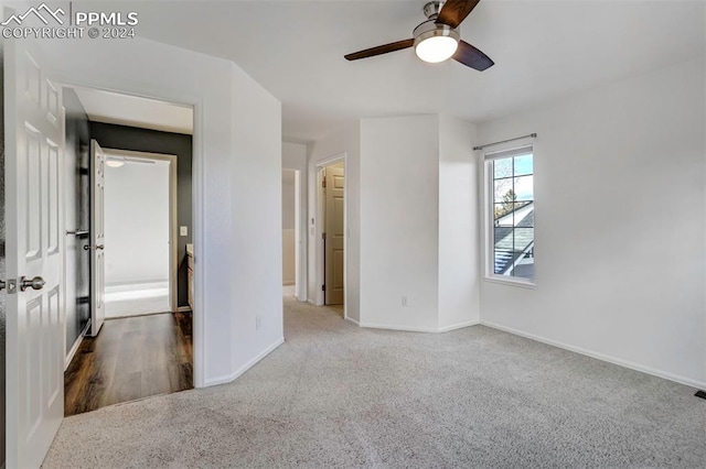 interior space with ceiling fan