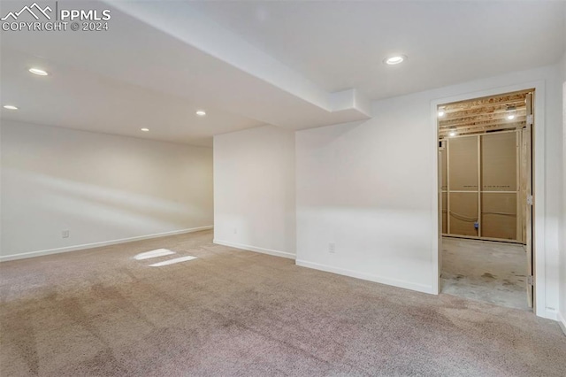 empty room with light colored carpet