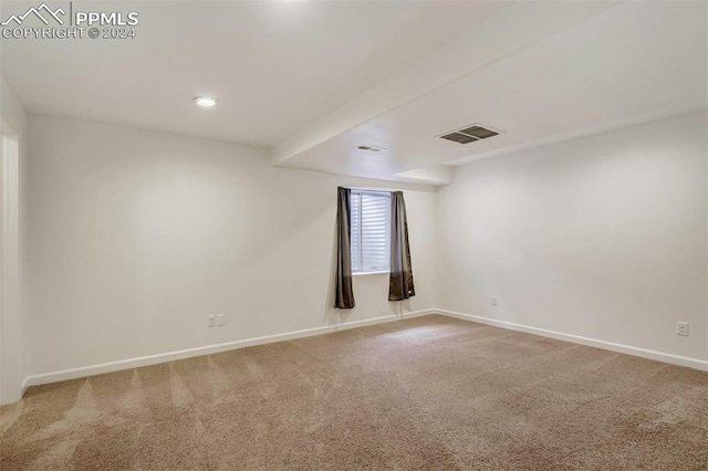 spare room featuring carpet flooring