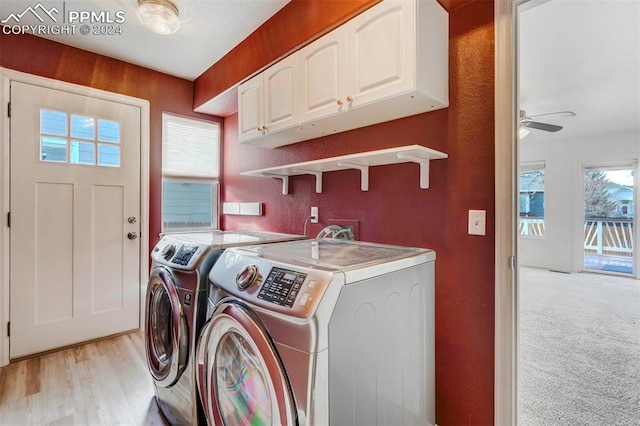 washroom featuring cabinets, independent washer and dryer, light wood-type flooring, and ceiling fan