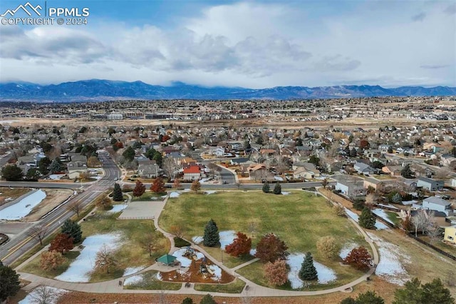 birds eye view of property with a mountain view