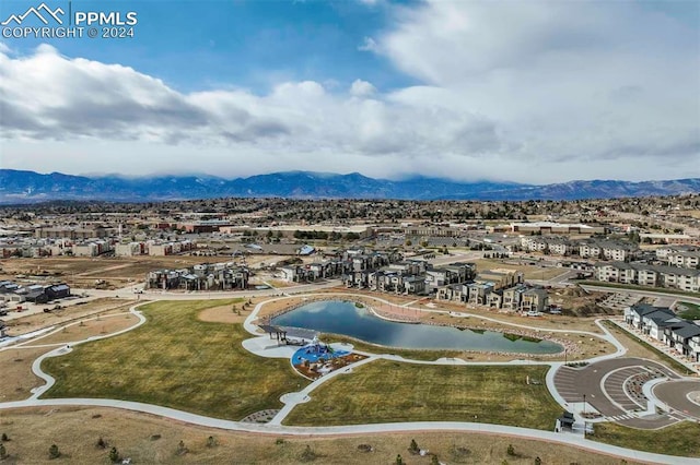 aerial view featuring a water and mountain view