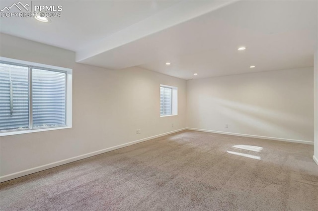 unfurnished room featuring carpet