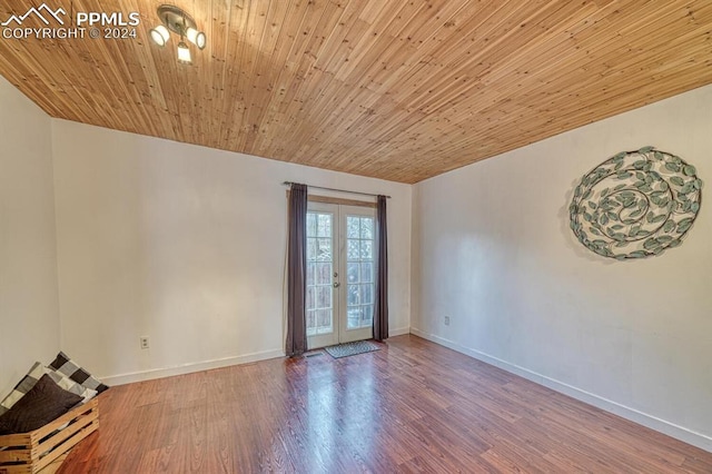 unfurnished room with french doors, hardwood / wood-style flooring, and wood ceiling