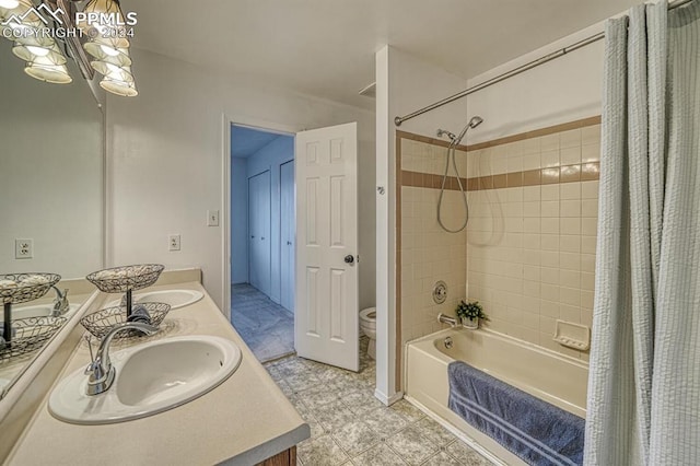 full bathroom featuring tile patterned floors, vanity, toilet, and shower / tub combo