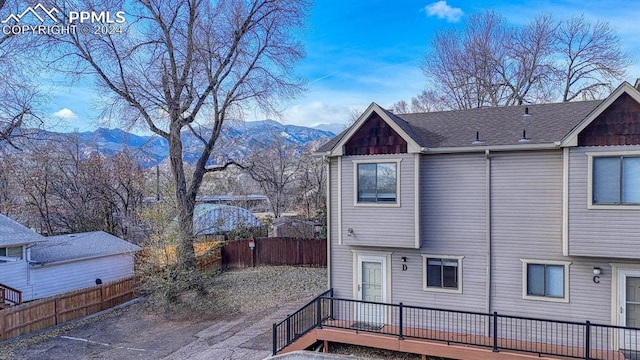 rear view of house with a mountain view