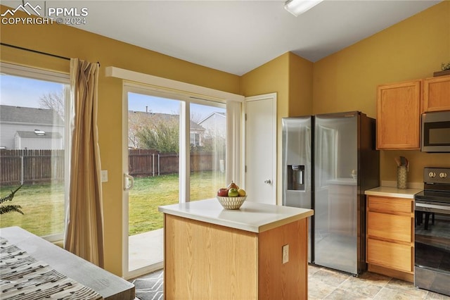 kitchen with a kitchen island and stainless steel appliances