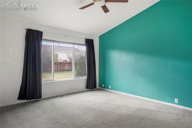 unfurnished room featuring carpet flooring, ceiling fan, and lofted ceiling