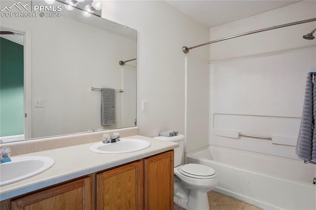 full bathroom with tile patterned flooring, vanity, shower / bathtub combination, and toilet