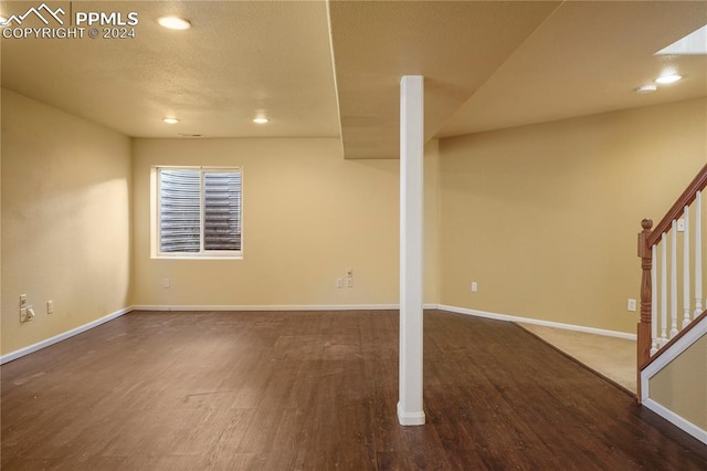 basement featuring dark wood-type flooring