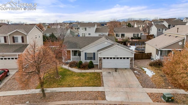 view of front facade with a front yard and a garage