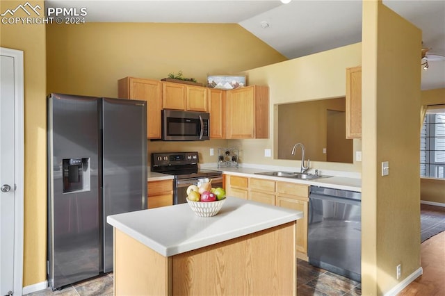 kitchen with a center island, lofted ceiling, sink, light brown cabinetry, and stainless steel appliances