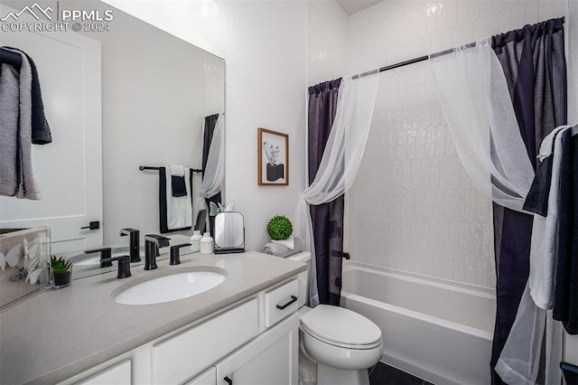 full bathroom with shower / tub combo, vanity, and toilet