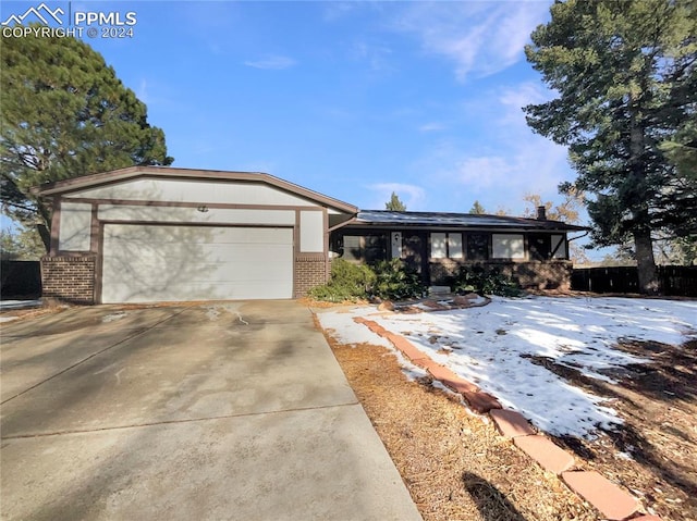 single story home with a garage