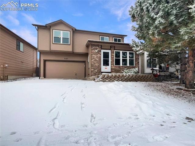 view of front of property with a garage