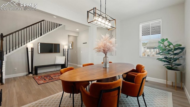 dining space with hardwood / wood-style flooring